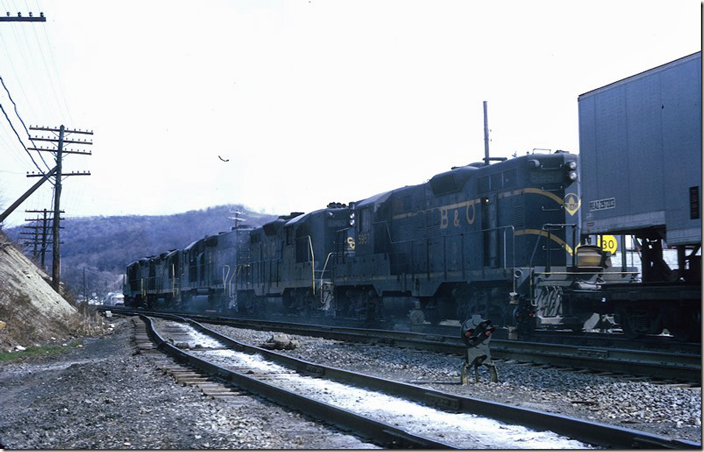 These engines are sanding heavily or GP38 4810 has a smoking traction motor. GP9s 5966 and 5957 came from the C&O. No. 5963 is still in C&O paint. Note the position light dwarf. B&O Clarksburg.