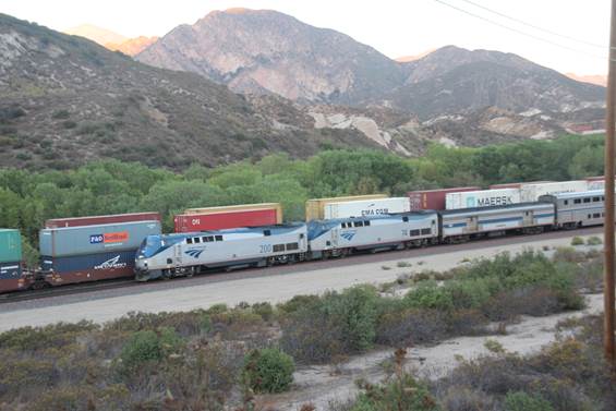 It is early morning and we are Cajon, Mile Post 62.8. On Track #3 is Amtrak’s Train No. 3, the Southwest Chief, headed by two GE DASH9-P42B locomotives #200 and #74.