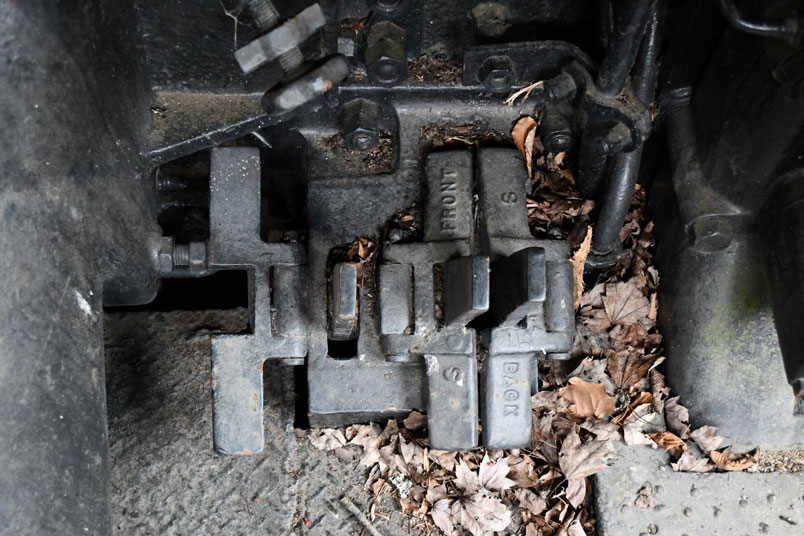 Levers to shake sections of the grate. A long rod used to move the levers.