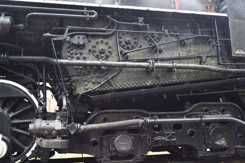 The long booster exhaust line is attached to the side of the firebox. The flexible cold water line from the tender to the Pyle-National Co. cold water pump is attached to the rear truck.