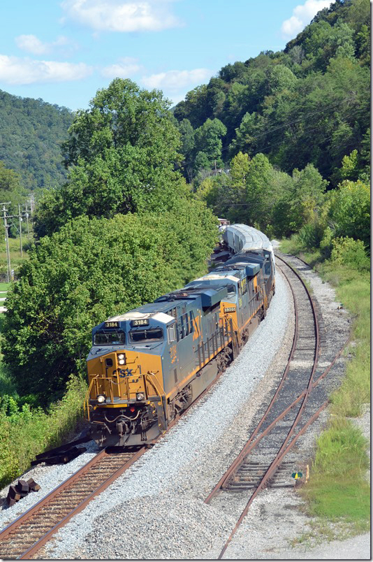 CSX 3184-5305 on w/b Q694 passing inactive mine siding at Levisa Jct. KY. 09-06-2021.