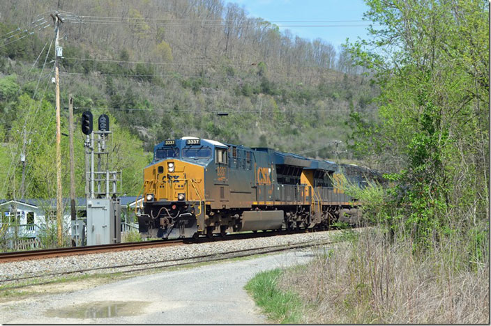 Q694-15 with CSX 3337-754-987 and Georgia Central 2140 passes the block signal at Betsy Layne KY with 90 cars. 04-17-2022.