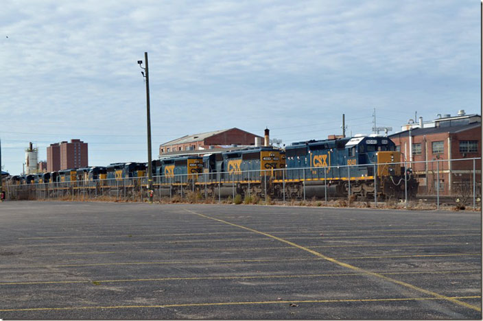 CSX SD40-2 8040 heads up a line of units at Huntington Locomotive Shop awaiting repair on 11-27-2021. Behind 8040 are “SD40-3” rebuilds 4033-4004-4034. Years ago we wouldn’t have had a fence to contend with.