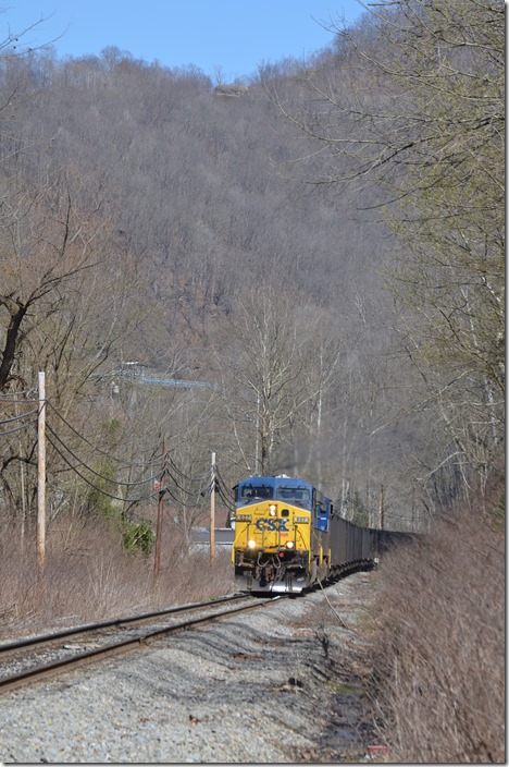 Now out on the main line H811 has loaded the last of 75 cars and awaits the conductor. The blue conveyor to the load-out is in the background. CSX 627-315. Braeholm.