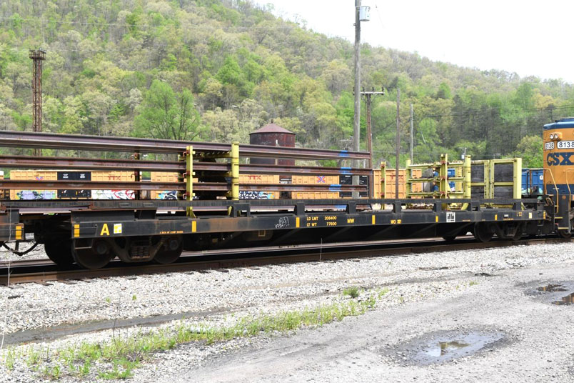 The front rail flat on train W012 with a bulkhead on the end. It was built or rebuilt in 12-2005. Most likely rebuilt. The rail was rolled by Nippon Steel in 2024.