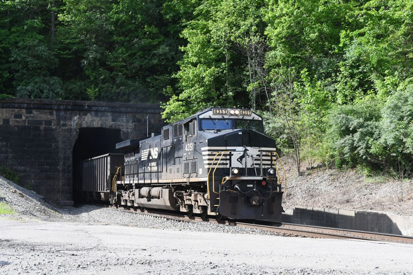 NS 4351 bursts out of Tunnel #4 with J14-18, eastbound coke empties of Vansant.