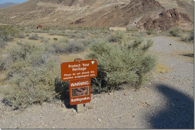 Protect Your Heritage sign. Rattlesnake warning sign. Rhyolite NV.