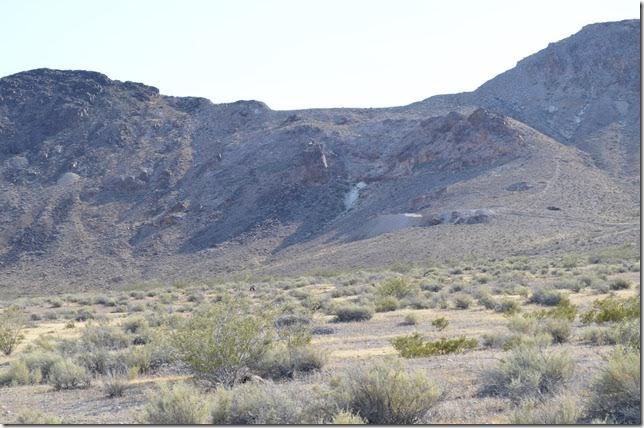 Old mine site looking west. The abandoned grade of the Las Vegas & Tonopah also goes around the hill before heading north to Goldfield. Rhyolite NV.