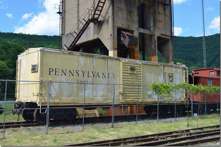 PRR 498313 built in 01-1939. Looks like it is in PRR MofW yellow paint. I think Penn Central used this color also. Renovo PA.