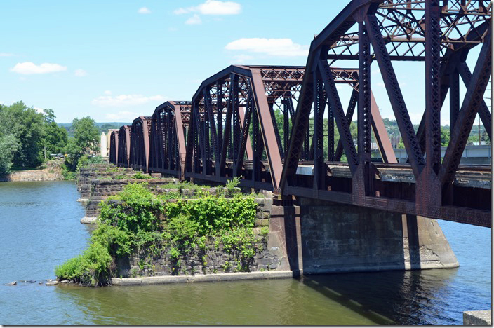 From the Sunbury end of the bridge we see that the oldest (1894) of the twin double track truss bridges has been removed. The existing bridge was added in 1925 to relieve congestion. NS bridge. Sunbury PA.