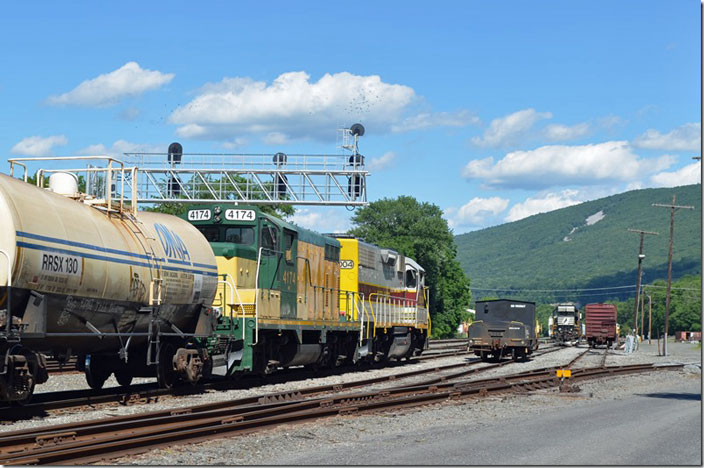 NBER pulls into yard. On the right is NS scale test car 982567 and GP38-2 5658. Lock Haven PA. NSHR 2004-NBER 4174.