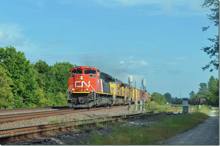 CN 8868-UP 8853-6767 hustle by with a northbound freight. Cora IL.