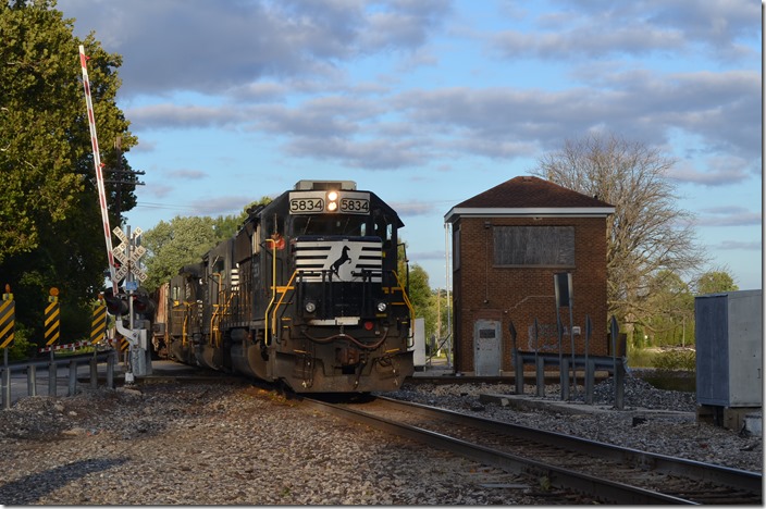 NS 5834-5155-556 slowly rumble into town with a westbound grain train.