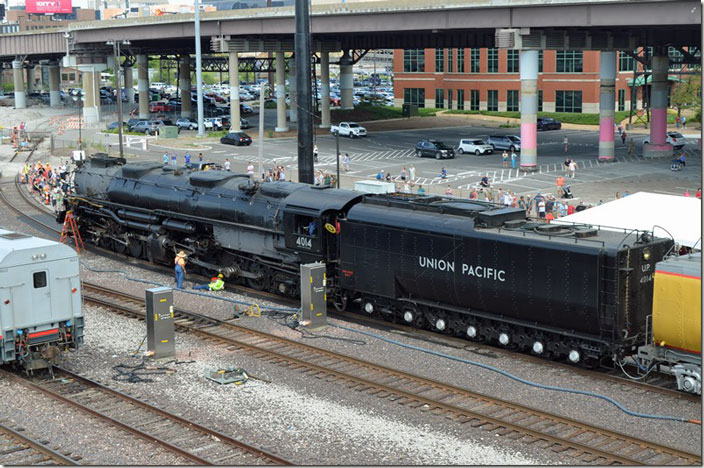 UP 4014 is being serviced. In the background is the wye entrance to union station and a signal bridge.