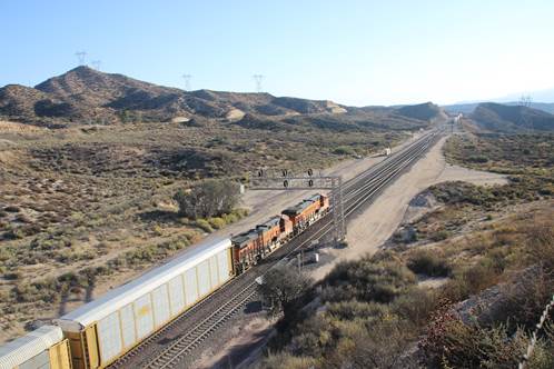 BN-SF 6853 and BN-SF 6873, both GE ES44C4, lead a unit train of autoracks eastward over Track #2.