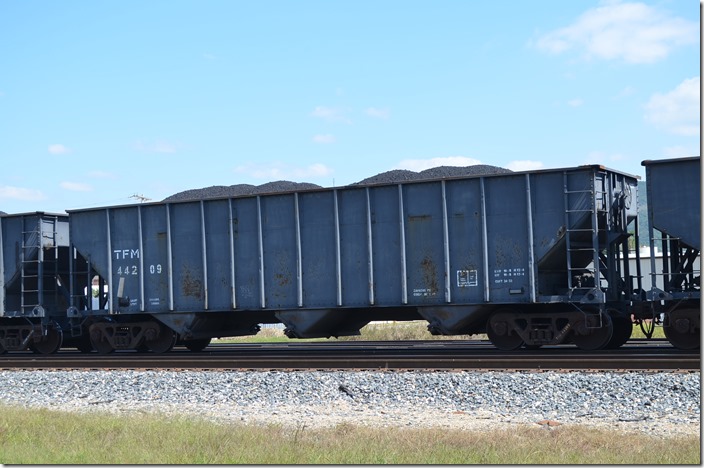 TFM (Kansas City Southern de Mexico) hopper 44209 has a volume of 3433 cubic feet. This coal was heading south in the consist of a freight. Heavener OK.