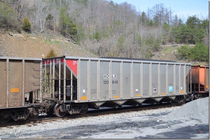 ADLX (Adler Funding LLC) hopper 120848 was built by FCA. It has a volume of 4200 cubic feet. Esco KY. 03-21-2015 in a Detroit Edison coal train heading off the SV&E SD.