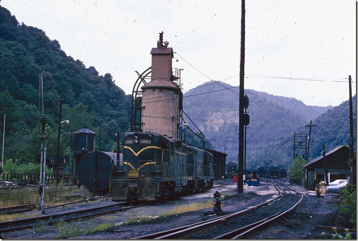 Same location at Cane Fork on 08-20-1973. 5882-5859 are in the view. The coal dock still served for dispensing sand. Big Coal, Cabin Creek SD.