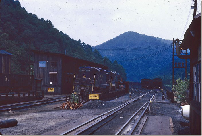 My first visit to Cane Fork Yard (Cabin Creek) on 06-20-1971. I took an introductory overnight weekend round trip through the WV coal counties visiting the places I had only read about in books. 5875, 5846 and 6095 are in this view. The yard was fairly large. Big Coal, Cabin Creek SD.