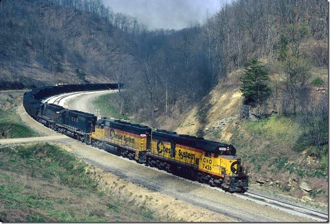 C&O 7426-7423-7502-7430 on Coal Run Shifter grinding up grade almost to tunnel at head of Millers Creek. 04-1982. Coal Run SD.