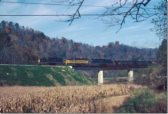 C&O 7421-7421-7428 on w/b Coal Run Shifter at mouth of Millers Creek starting up grade to tunnel. 10-1979. Coal Run SD.