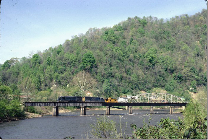 After leaving their empties at the West Gilbert tipple, Extra 8205 crosses the Guyandotte River. This is N&W track from West Gilbert to Gilbert Yard. VGN never used it for anything, but undoubtedly wanted it in place to obstruct C&O expansion on up the river. It worked. It is still in place although inactive for many years. C&O Logan, Buffalo, IC SD.