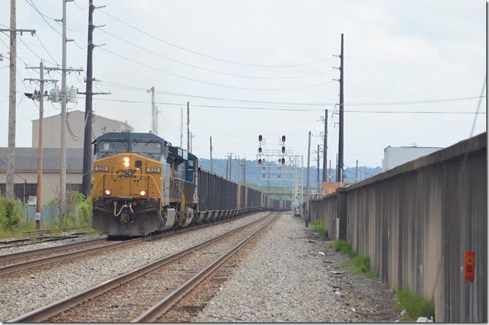 As our bus was loading, a westbound coal train rolled toward Russell behind CSX 529-962. The rusted track on the far left belongs to AK Steel. It was once used by their coke trains to and from the plant at Clyffeside. Ashland KY.