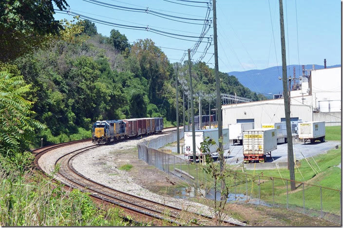 CSX 6493 on H744 (Lynchburg-Balcony Falls local) works a paper industry at Big Island VA on Thursday, August 23rd.