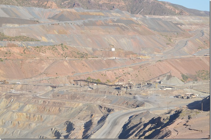 After running around their train of empty gons, OT-1 will shove their cars almost to the end of the track on the lower left. The load-out is near the stockpile. ASARCO Ray AZ copper mine.