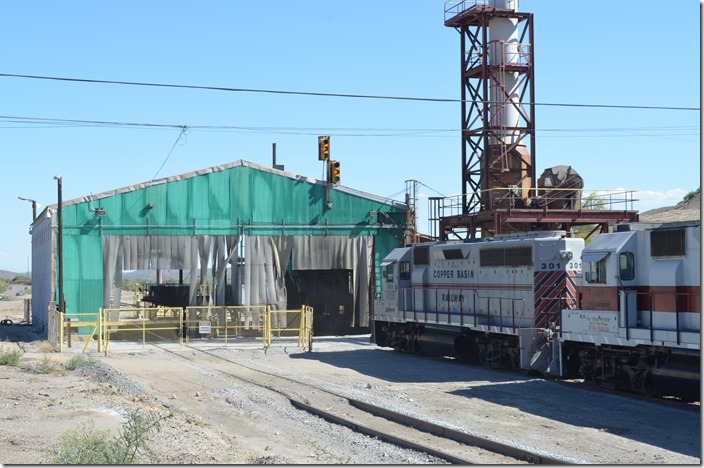 The gate has been manually opened, and the yellow signal indicates the train to approach. CBRY 301. ASARCO dumper. Hayden AZ.