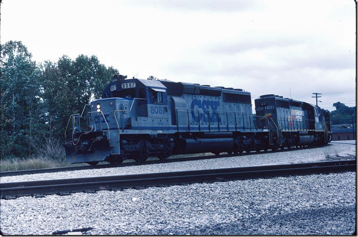 CSX 8047-8169-8132 lead a train of empties around the south leg of the wye and out the Cumberland Valley Subdivision. 10-03-1987. Corbin KY.
