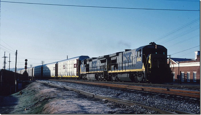 CSX B36-7 5840 with C40-8W 7654 depart Corbin with northbound empty auto rack train S212 (2nd section). 11-21-1993. CSX Corbin KY.