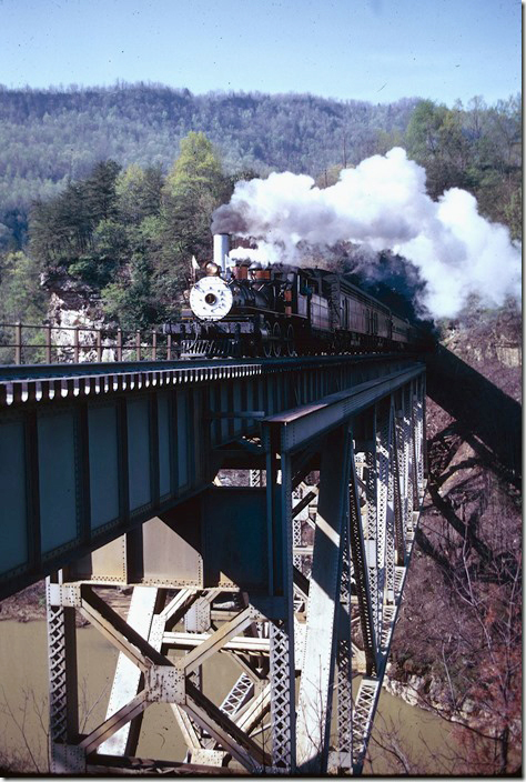 CC&O #1 crossing Pool Point bridge near Elkhorn City with s/b excursion. 04-27-1975. CRR Erwin.