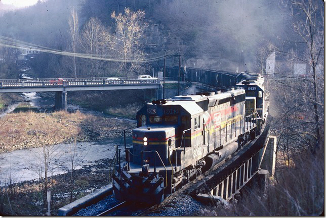 SBD 8062-1242-8282 come down the Greenbrier Branch at Haysi. Its 11-19-1983 and the Greenbrier Turn will follow the annual Santa Train to Dante.