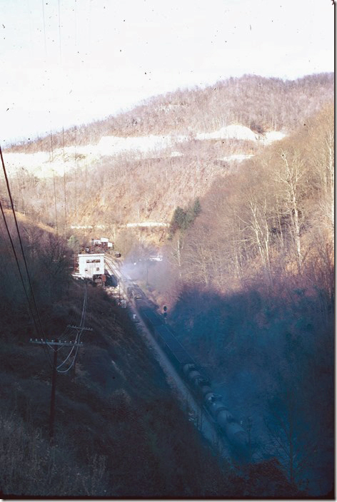 Late on this autumn day an Elkhorn Turn starts down grade at Trammel after traversing Sandy Ridge Tunnel. 11-10-1974.
