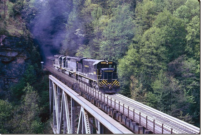 U36C 3604 leads SD45-2 3619 and SCL 2014 on #26. 04-28-1974. Pool Point.