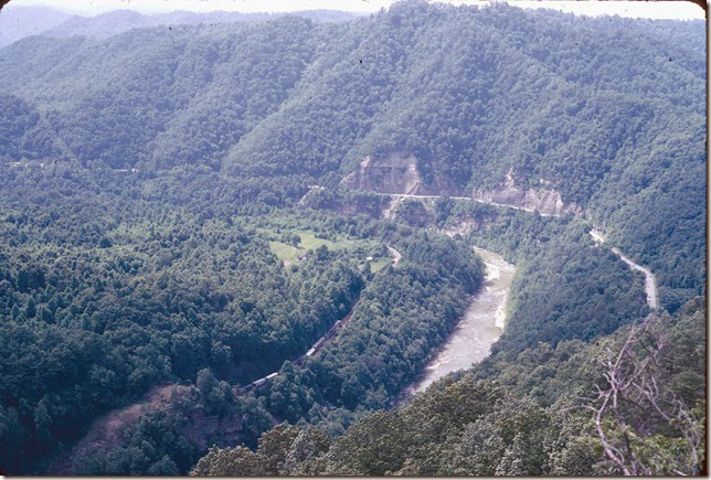 View from State Line overlook at the Breaks Interstate Park. CRR #95 n/b is exiting State Line Tunnel heading toward Elkhorn. 06-22-1975. Nora.