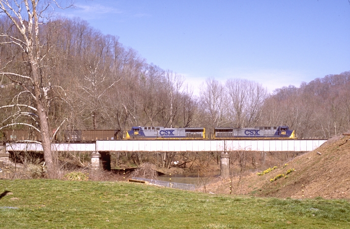 CSX AC44s 242-380 have just left Loyall Yard and are crossing the Cumberland River at Baxter, Ky.