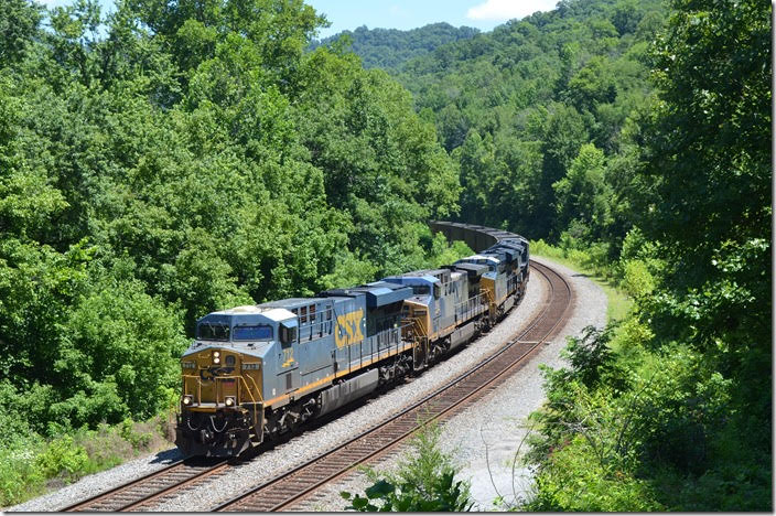 CSX 712-266-3190-3449 have w/b empty DKPX (Duke Energy) hopper train E760-06 on their way to Russell. 07-08-2018. FO Cabin KY.