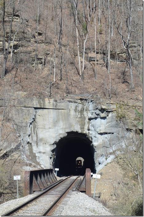 CSX 533-338-3297 enter Robinson Creek Tunnel on the Sandy Valley & Elkhorn SD. This tunnel was built by the B&O in 1912. The lining was burned out a couple of years ago in a case of arson. 03-03-2018.