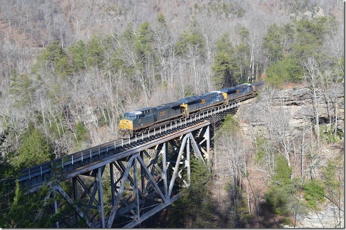With N760 waiting at Marrowbone, I went ahead to Elkhorn City for a shot at Pool Point bridge. The path to this overlook had been beaten down by railfans during the run of the Santa Train in November. CSX 102-3438-3091 brake down grade with T209-15 and 149 loads of metallurgical coal from McClure VA mine. McClure coal goes to Newport News or steel mills in the Midwest. Pool Point.