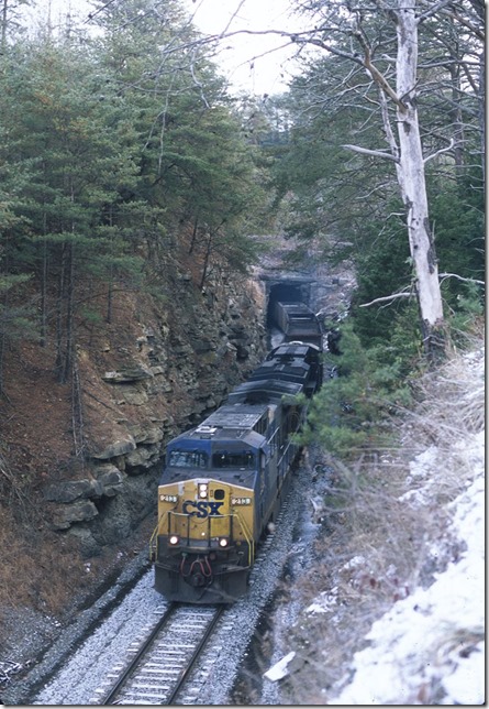 CSX 213-983 on E/B empty train N824-27 exiting Buffalo Tunnel near Thealka, Ky. Train consists of KCLX, HEQX, MBKX, CEFX and SPSX equipment, but the DEEX cars indicate it is actually a Detroit Edison train. This is the only remaining tunnel on the Big Sandy main line. 11-30-2013.