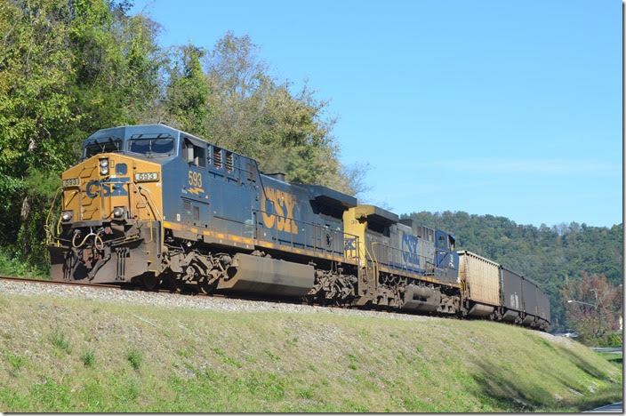 CSX 593-39 on e/b U209-18 with 100 empty tubs held back at the west end of Pauley until K446 passed, so as not to block crossings. U209 is now moving up the siding expecting a medium clear at the east end of Pauley KY. 10-19-2018.