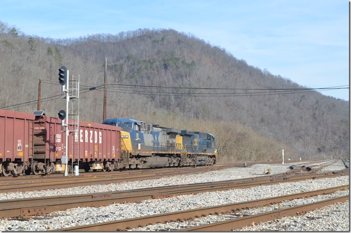 CSX 86-81 arriving Shelby KY with a train of 51 Herzog Contracting empty ballast cars. 12-08-2019.