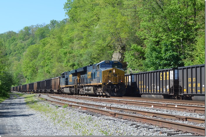 CSX 3470-931 have 200-car T209 westbound passing Ivel on 05-20-2020. This train loaded at McClure VA, on the old Clinchfield. Those modern tubs on the right are stored in the passing siding. Ivel KY.