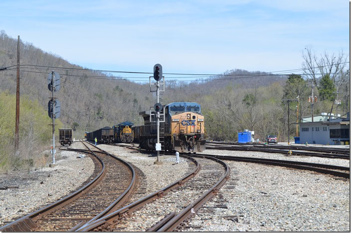 A s/b DKPX coal train on the main line departs around the curve for Kingsport. That hopper on the left is parked in the “coach track.” CSX 253-3442. Shelby KY.