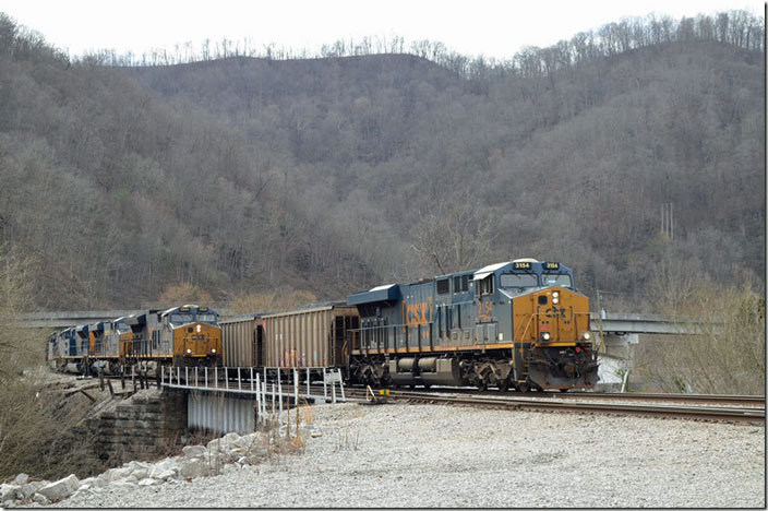 CSX 3154 waits on the main with e/b N760-11 (Newell PA to Brice NC - Duke Energy) as U903-08 e/b (Russell-Shelby) comes up the lead with 200 empties. CSX Shelby. CSX 3154 3333-727-8908-7213. 03-13-2021.