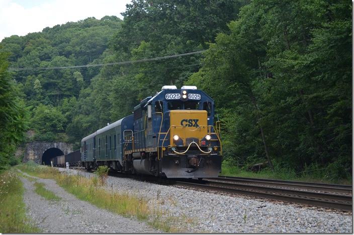 Track geometry train W001-27 has office car “Columbus” and the TGC car. I saw it a couple of weeks later on Big Sandy with the same consist. CSX 6025 is the regular engine. T051 disappears into Kingwood Tunnel and the head end is rolling through Tunnelton. Austen WV.