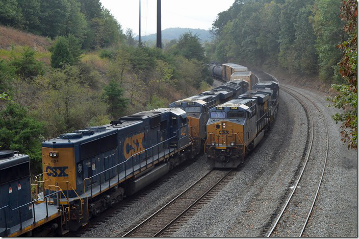 CSX DPUs 3158-356 are pushing. That’s Q371 waiting for a yard crew to drag it in. Mexico MD.