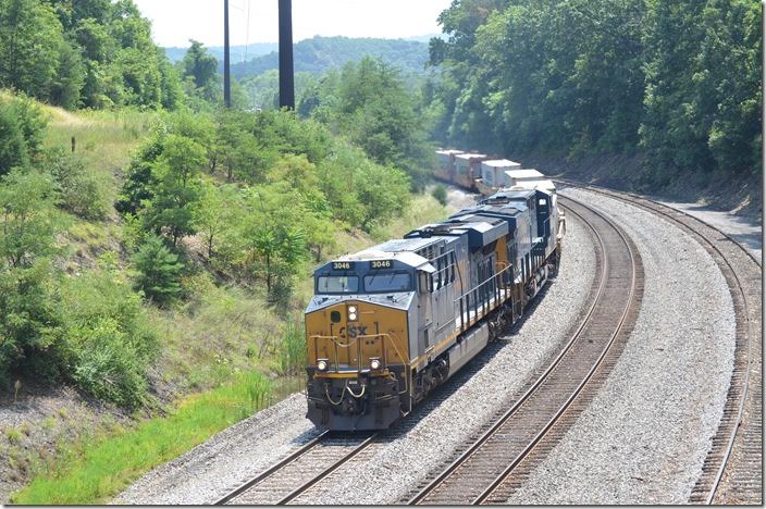 CSX 3046-3143 brakes around the curve with westbound Q135-28 (Portsmouth VA to North Baltimore OH). He has 152 single-stack wells today. Mexico MD.